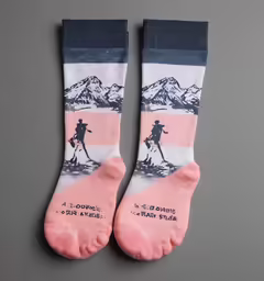 a pair of pink and blue socks showing mountains