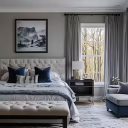 a large white bed sitting inside of a bedroom