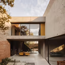 an exterior shot shows an outdoor patio with two tables