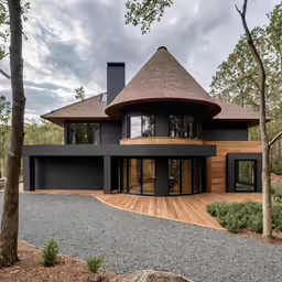 the home is situated on the hill overlooking a lot of trees