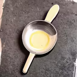 the dirty spoon is lying on the ground