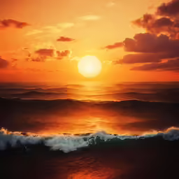 a sunset with sun shining over the ocean waves