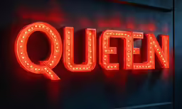 the queen sign is glowing in neon yellow lights