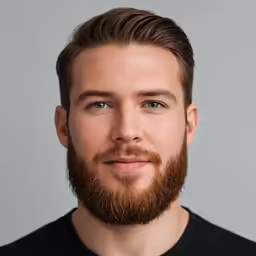 a man with a beard in a black shirt