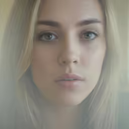 the woman is wearing blue eyes and has a serious look