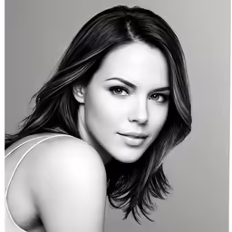 a beautiful woman posing for the camera in a black and white photo