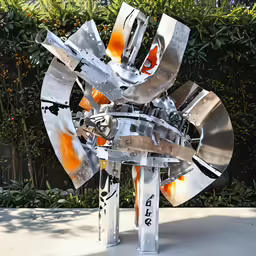 some metal sculpture with different colors on it