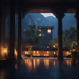 the large entrance to a large house lit up with lights