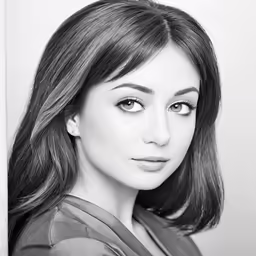 black and white photo of a woman with shoulder length hair