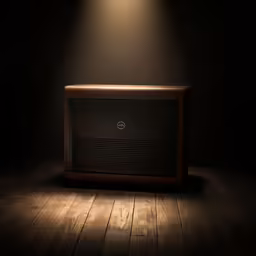 an empty old fashioned radio on a wooden floor