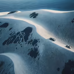 aerial view of sand dunes and ocean waters