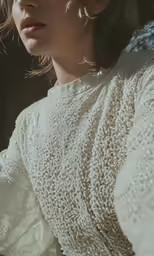 an artistic photograph of a young woman in a white dress