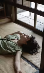 woman lying on floor with her hand on her hip
