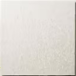 a man is walking beside a white wall