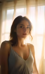 a woman standing in front of curtains, with her hands on the knees