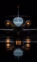 the front end of a small plane is shown in the dark