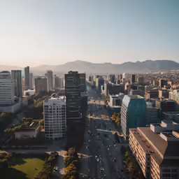 a view of a city with mountains in the background