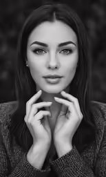 black and white photo of woman with arms crossed