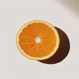 an orange sliced in half, with only one piece remaining