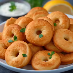 a white plate full of fried onion rings