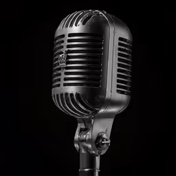 the microphone is on a table with black background