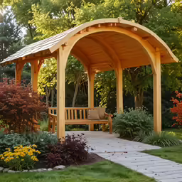 a wooden bench sitting in front of trees and shrubs