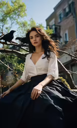 a woman sitting in the branches of a tree