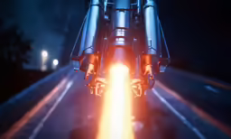 the front end of a motorcycle turning as a glowing orange ball of light shines in the distance