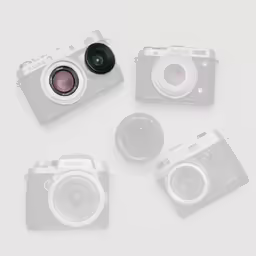 four digital cameras sitting on top of each other