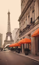 a street lined with orange umbrellas and a brown building