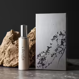 a bottle sitting next to an object with the word plant printed on it