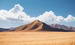 a few clouds are in the sky over some hills