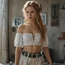 the woman is standing in her bedroom looking down