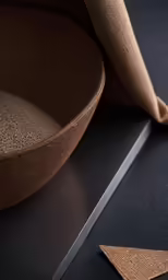 a closeup of a round shaped object on a black surface