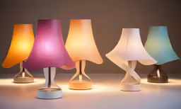 four lamps, one different shades in the shape of an airplane
