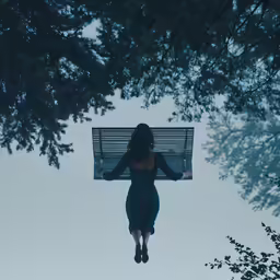 a woman who is jumping off of a bench into the air