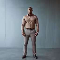 a man posing for a picture in a business suit