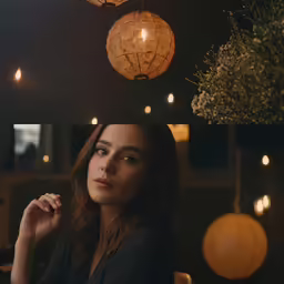 a girl sits and smokes in a restaurant