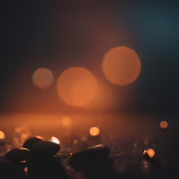 a table topped with lots of rocks covered in lights