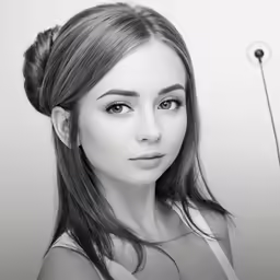 woman wearing a dress looking up with a hair clip in front of her
