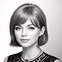 a woman in black and white poses for the camera