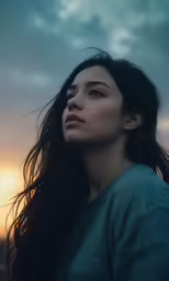 a young girl staring off into the distance