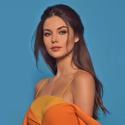 a woman wearing an orange top is posing