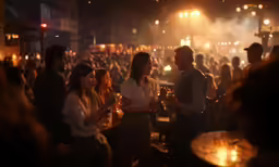 people standing in a crowded area at night