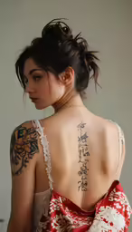 a woman with a very big tattoo on her back