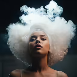a woman with white hair and smoke coming from her head