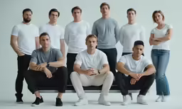 a group of young men sitting next to each other
