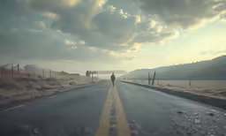 a lone person is standing on the road at sunrise