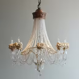 chandelier hanging in a fancy white room