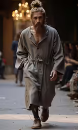 a man with a beard walks down the street